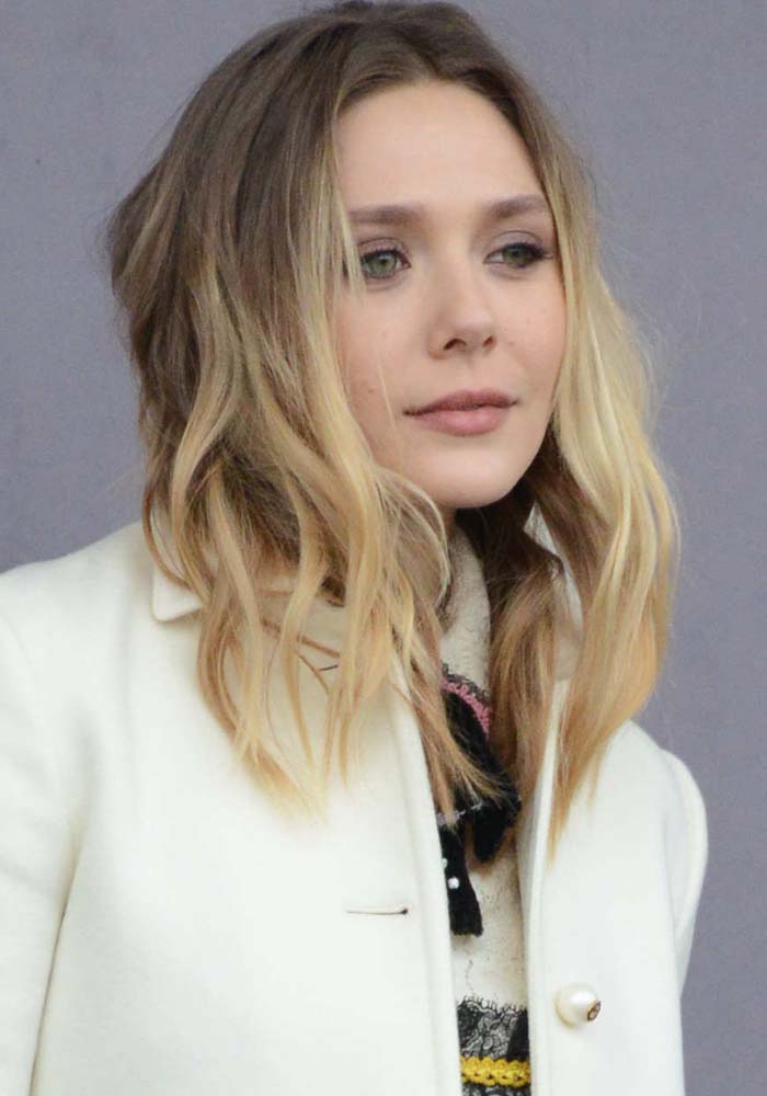 Elizabeth Olsen wears her hair down as she arrives at Milan Fashion Week Fall Autumn/Winter 2016/17