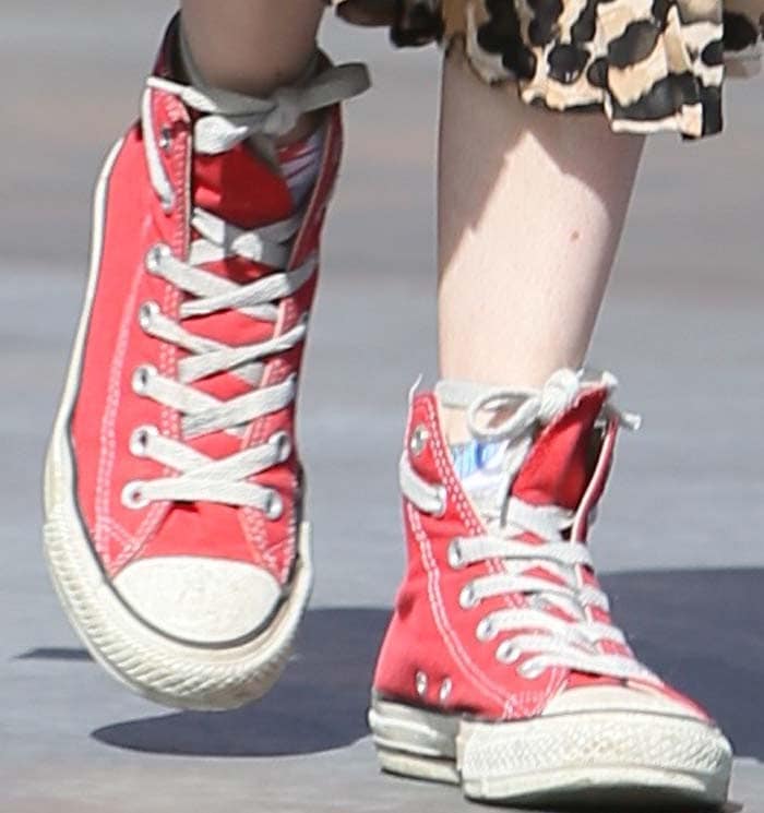 Emma Roberts wears red Converse Chuck Taylors All-Star Classic high top sneakers