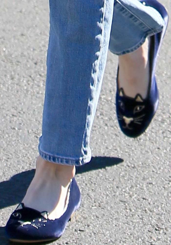 Emma Roberts wears blue velvet Charlotte Olympia "Kitty" flats