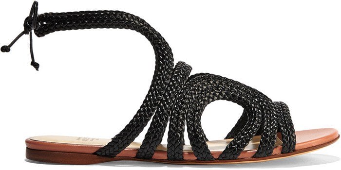 This braided flat sandal is set on a comfortably cushioned footbed and a pretty antique-rose sole