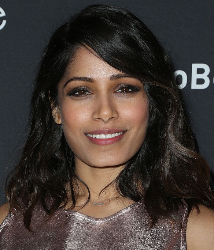 Freida Pinto wears her hair down at the premiere of "Two Bellmen Two"