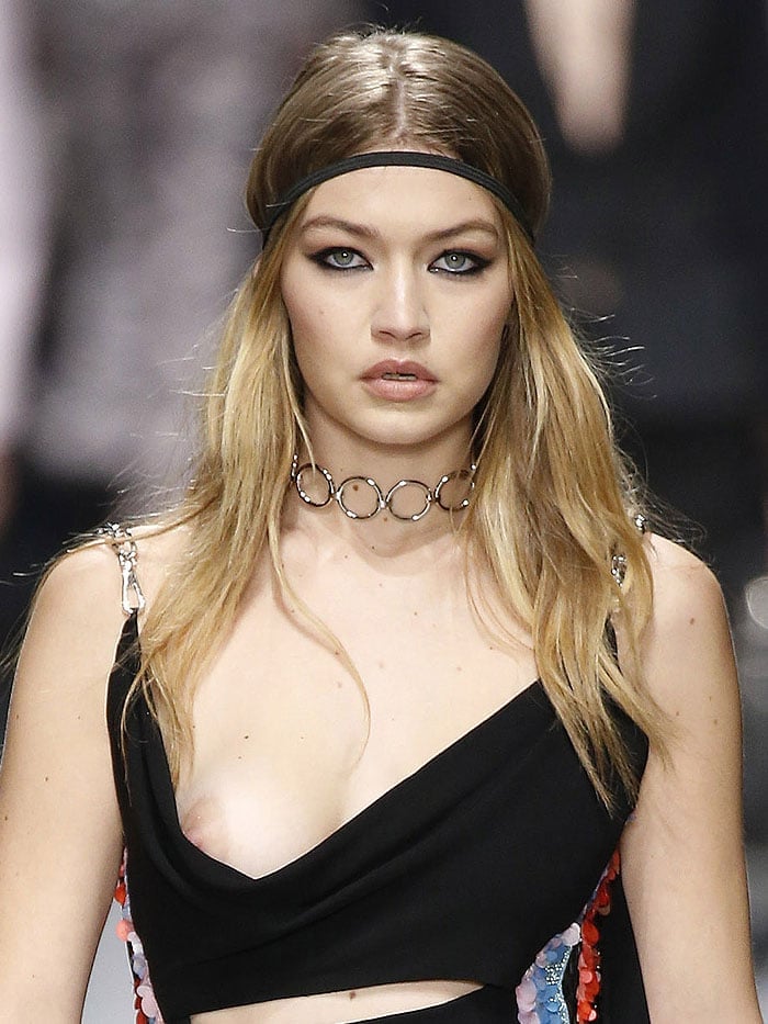 Gigi Hadid suffering a nip slip while modeling for the Versace fall 2016 fashion show held during Milan Fashion Week in Milan, Italy, on February 26, 2016.