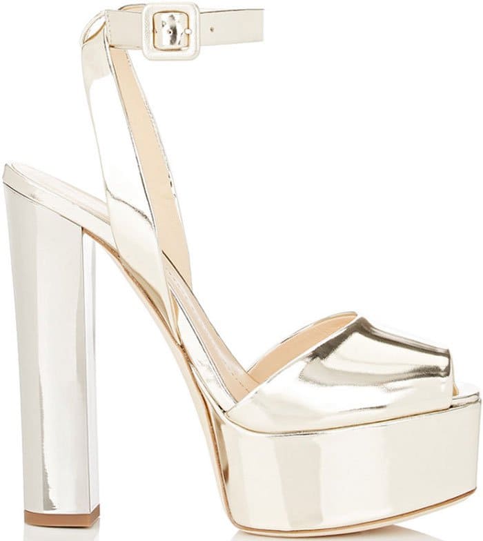 A block heel and thick platform add modern drama to an ankle-strap sandal presented in molten metallic calfskin leather