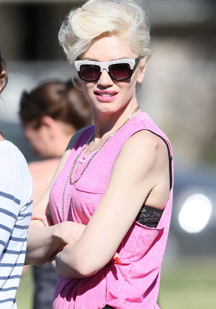 Gwen Stefani wears her hair back at son Zuma's flag football game