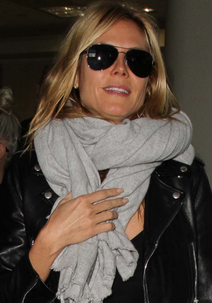 Heidi Klum wears her hair down as she arrives at Los Angeles International Airport