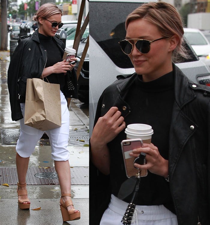 Hilary Duff leaves a Hollywood cafe in white jogger shorts and a black leather jacket