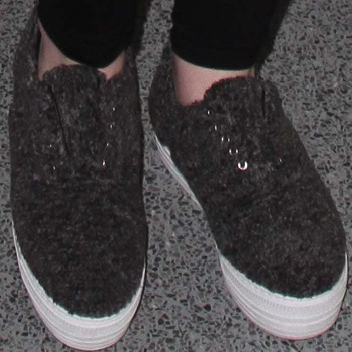 Iggy Azalea's feet in shearling Joshua Sanders sneakers