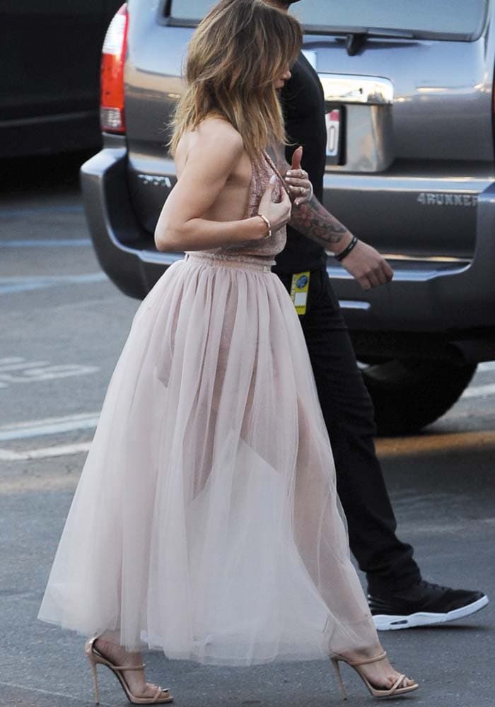 Jennifer Lopez wears a soft pink Valentino dress as she arrives at the "American Idol" finale