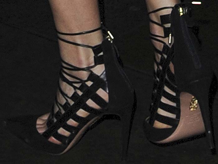 Karlie Kloss's feet in strappy black Aquazzura sandals