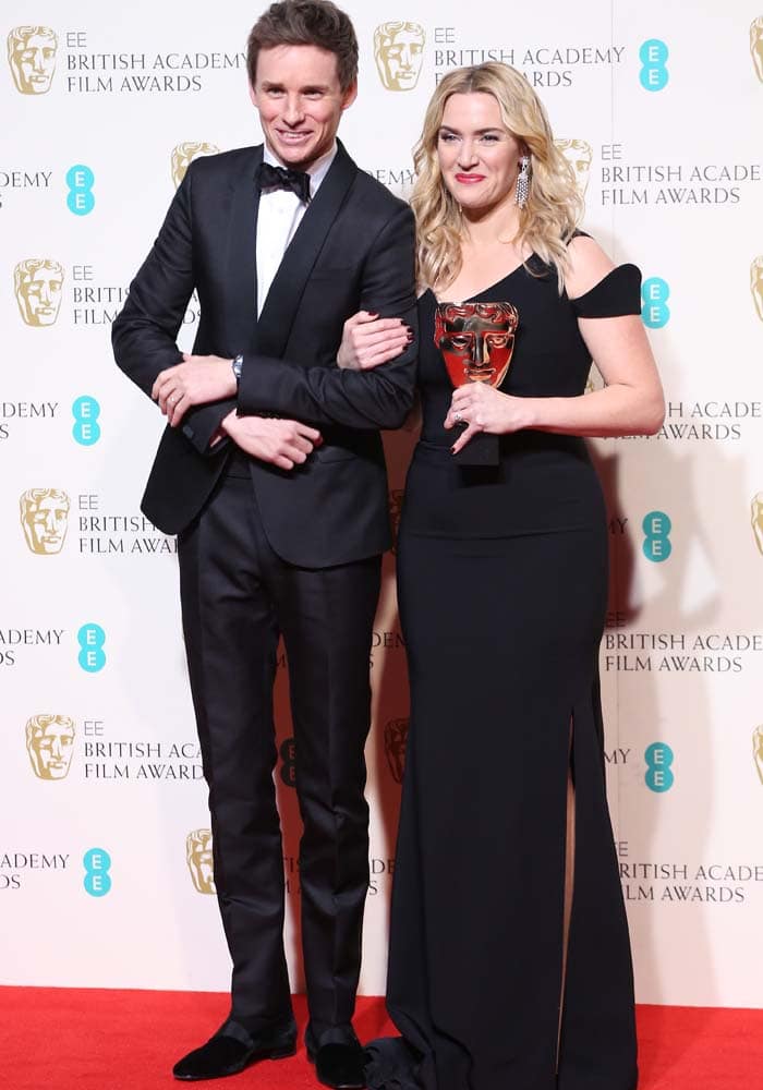 Eddie Redmayne and Kate Winslet pose for photos at the BAFTAs in London