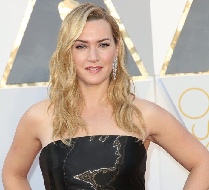 Kate Winslet wore a black strapless gown with a subtle shimmer, made of custom-made silk lamé by Ralph Lauren