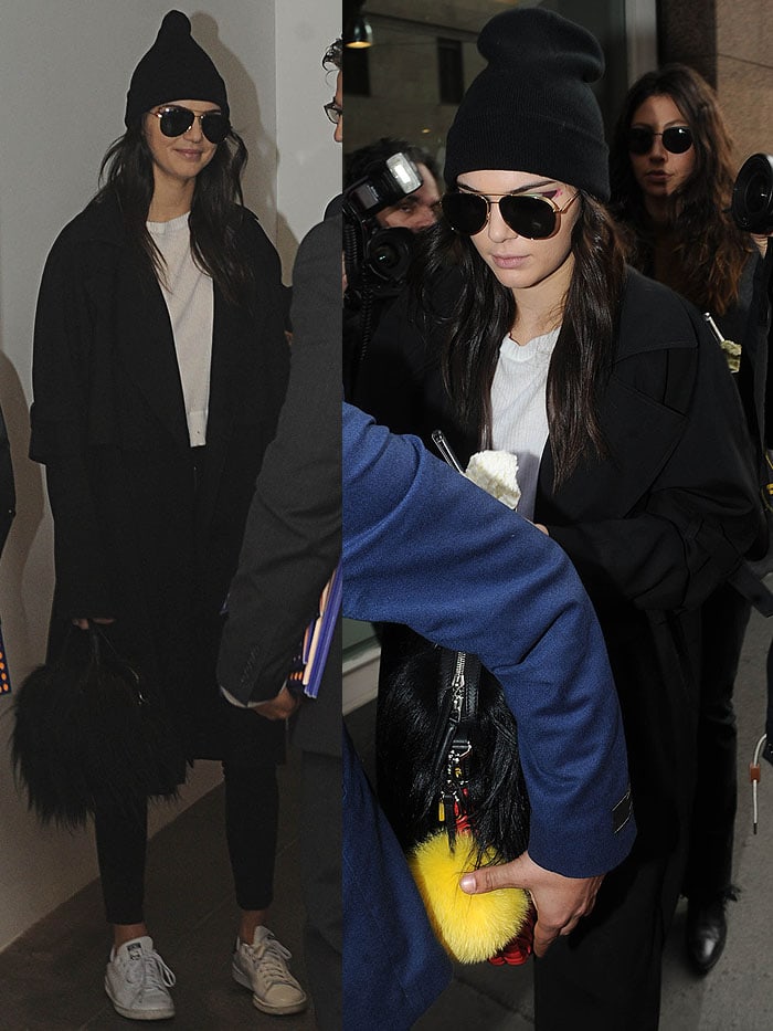 Kendall Jenner wears a beanie over her hair as she leaves the Fendi Fall 2016 fashion show