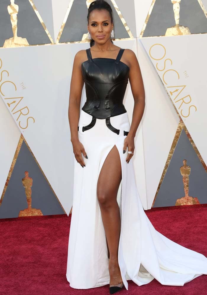 Kerry Washington commands attention at the 2016 Academy Awards in a custom black leather Atelier Versace bustier gown paired with leg-lengthening Gianvito Rossi Plexi pumps