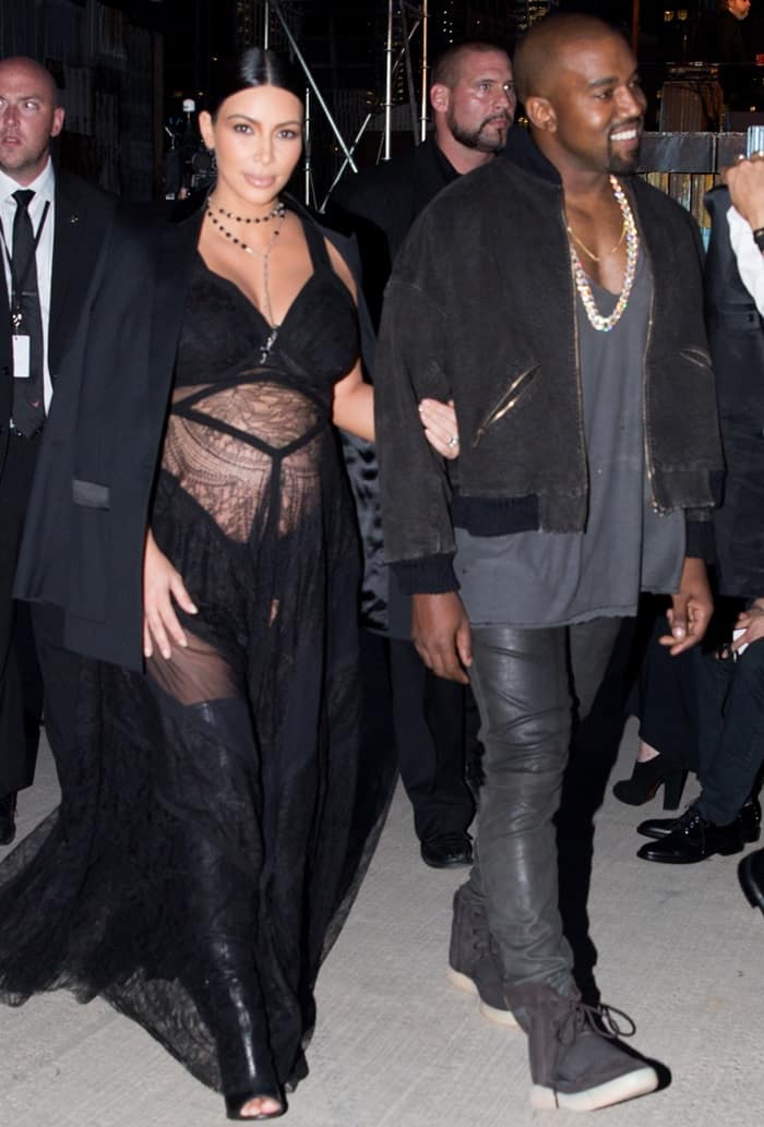 Accompanied by her husband, Kanye West, Kim Kardashian turned heads at the Givenchy Spring Summer 2016 fashion show in New York in a sheer lace gown that revealed her growing baby bump to onlookers