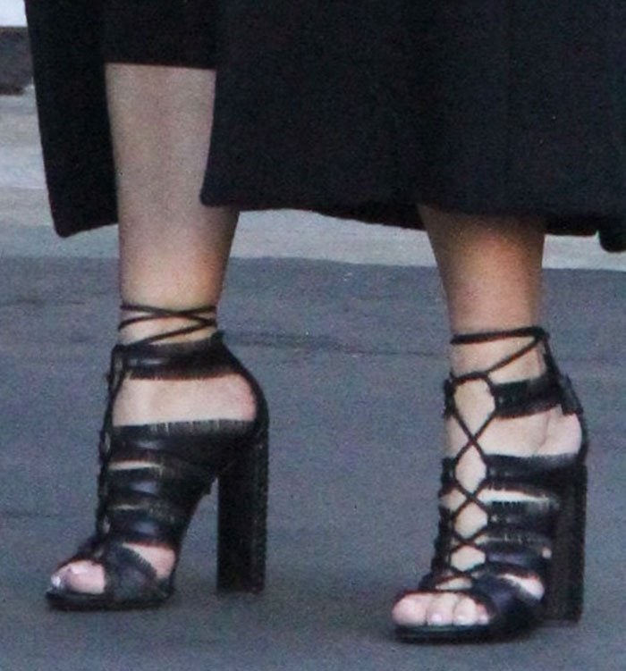Kim Kardashian in Tom Ford sandals with eyelash fringe trims on the straps, ghillie ties and 4.5-inch whipstitched chunky heels