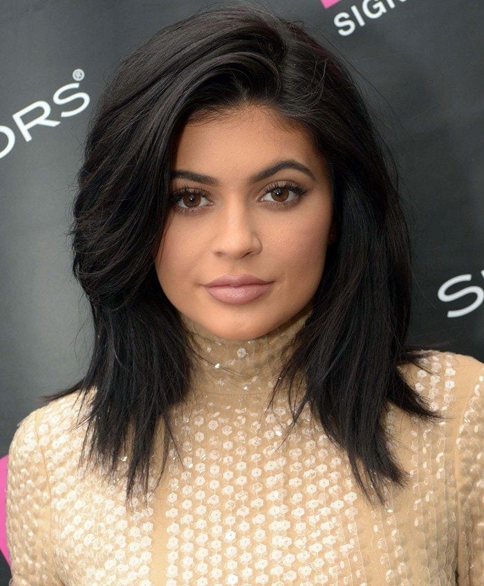 Kylie Jenner wears her hair down at the launch of her Signature SinfulColors nail polish shade