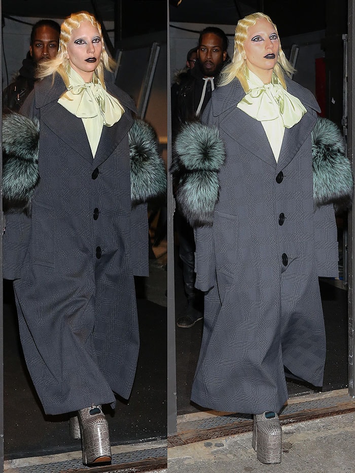 Lady Gaga rocks a pistachio green pussy-bow blouse, a generously sized gray coat with furry arms, and stylish gray platform boots