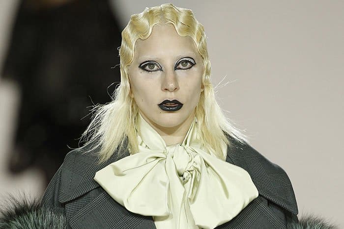 Lady Gaga wears the signature Francois Nars black-out eye makeup with black lip lacquer at the Marc Jacobs Fall 2016 fashion show held during New York Fashion Week