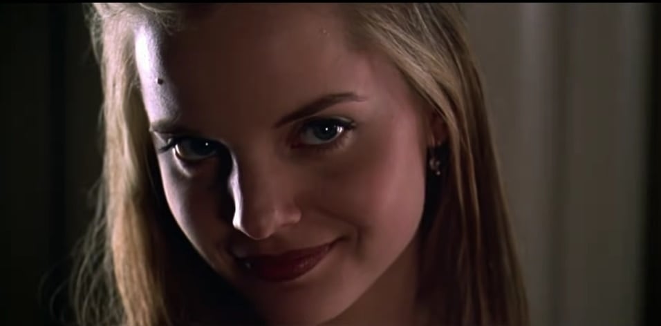 Mena Suvari as Angela Hayes in American Beauty (1999), delivering a captivating and intense performance that earned critical acclaim