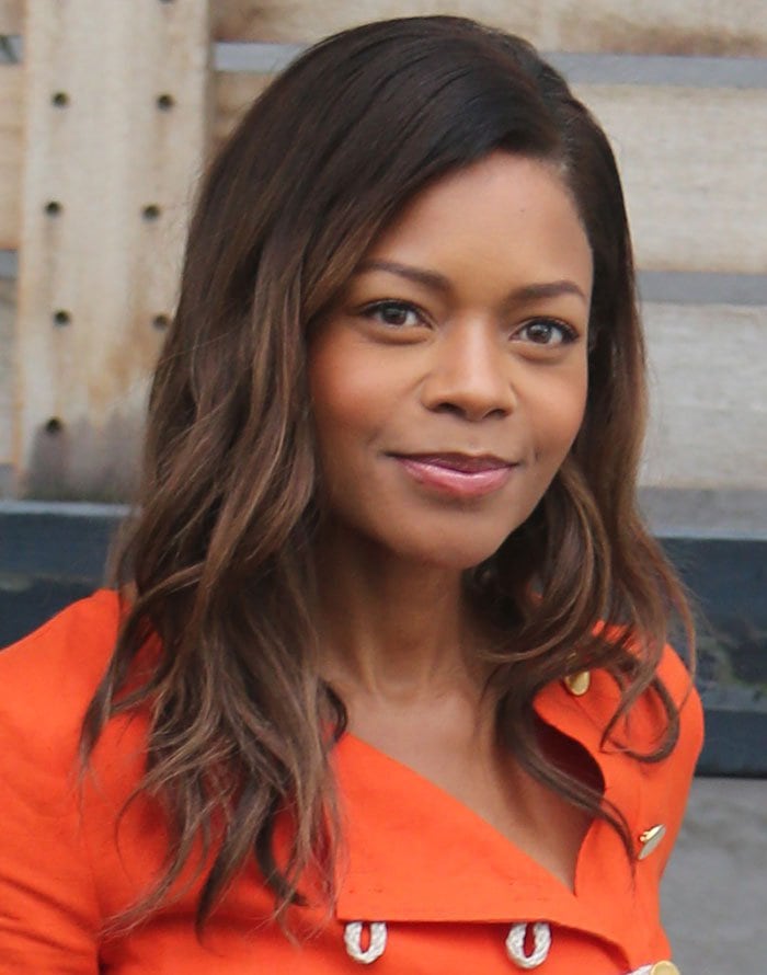 Naomie Harris wears her hair down during a London trip to promote the DVD release of "Spectre"