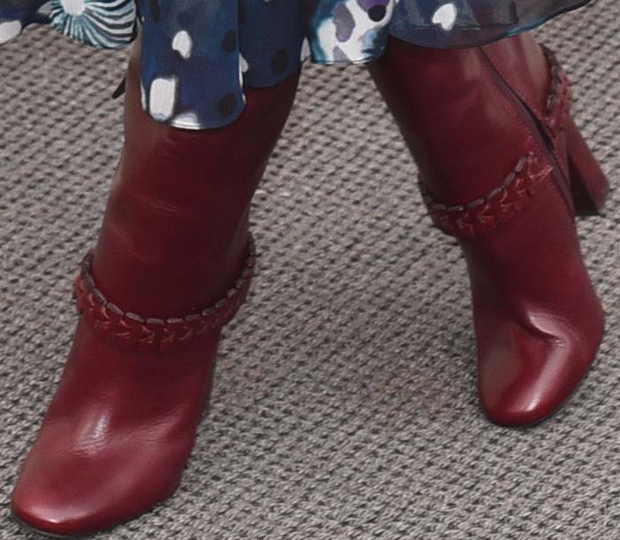 Olivia Palermo wears a pair of burgundy Tory Burch boots out in London