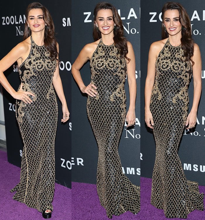 Penelope Cruz stuns in a floor-length black-and-gold Balmain gown reportedly paired with Brian Atwood sandals