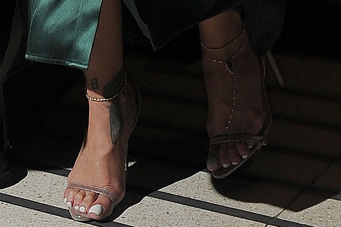 Rihanna's pretty feet in Brian Atwood 'Aniston' slingback sandals accessorized with gold ankle chains