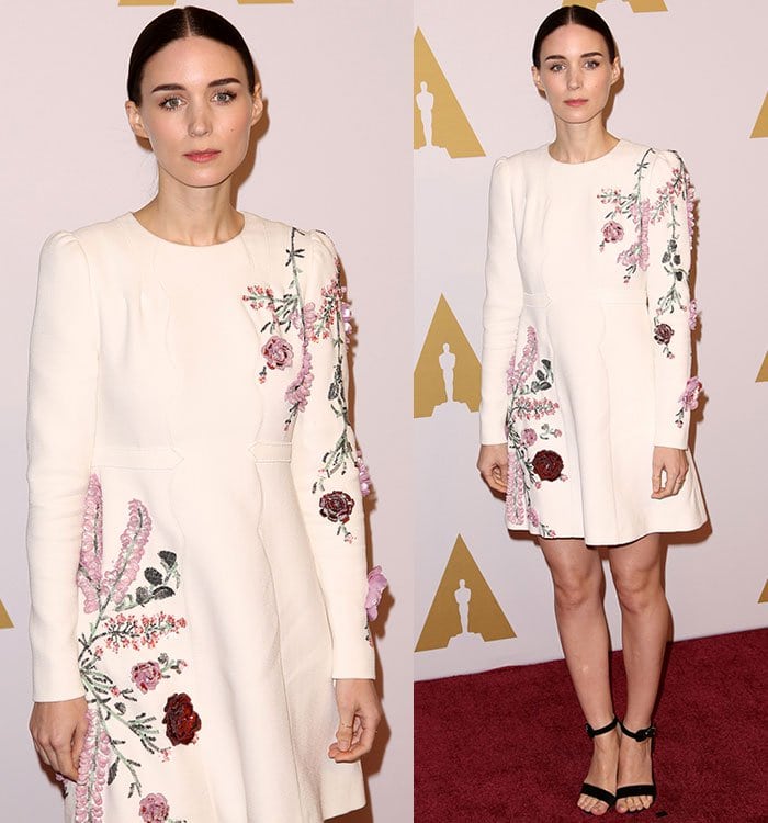 Rooney Mara wears a long-sleeved embroidered Giambattista Valli dress on the red carpet with a pair of black ankle strap sandals