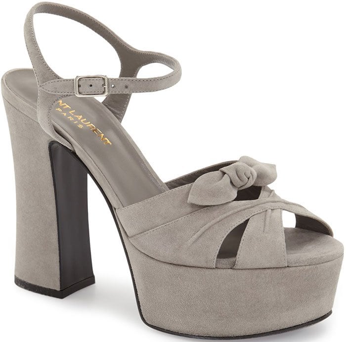 Retro-chic leather sandal fashioned with a slim ankle strap and a graceful bow embellishment