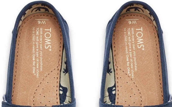 The insoles display the TOMS mission statement