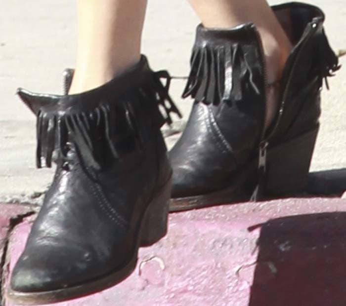 Vanessa Hudgens's feet in fringed western-style booties