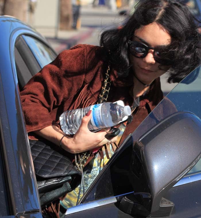 Vanessa Hudgens exits her car during a Los Angeles shopping trip