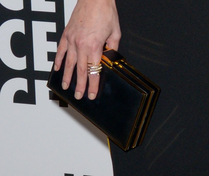 Chloe Bridges toting a black, acrylic clutch