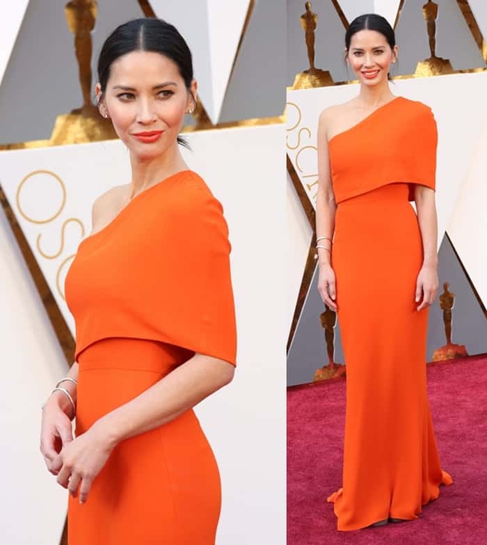 Olivia Munn in a bright orange Stella McCartney gown at the 88th Annual Academy Awards