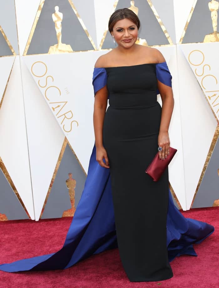 Mindy Kaling opts for a sleek off-the-shoulder Elizabeth Kennedy gown with a dramatic blue train at the 88th Annual Academy Awards