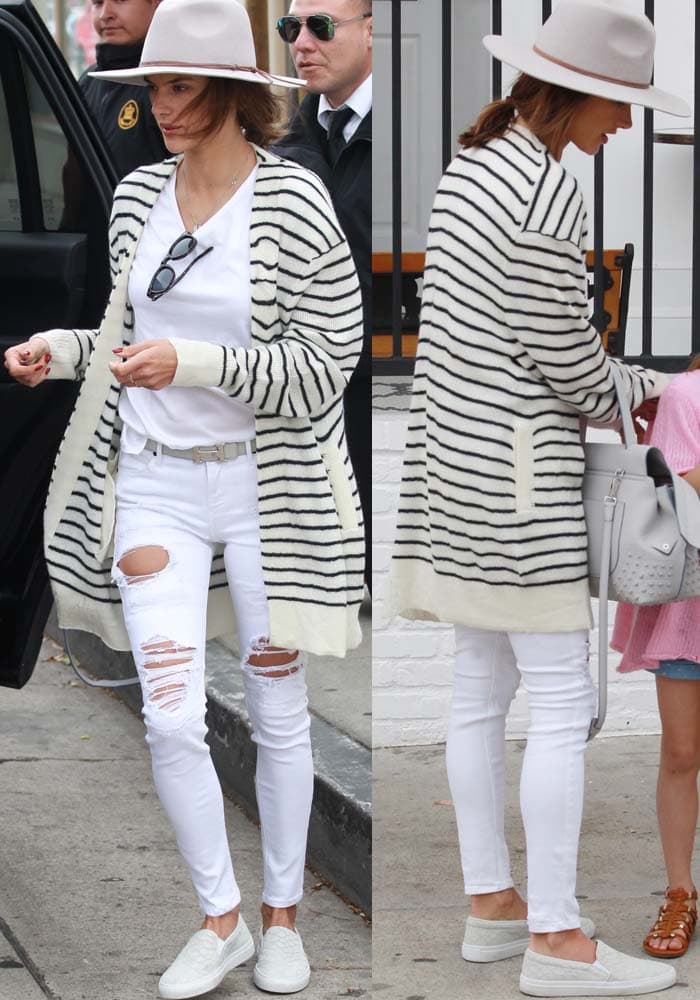 Alessandra Ambrosio pairs a striped Rta cardigan with white Frame jeans