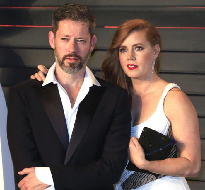 Amy Adams and Darren Le Gallo exude sophistication at the 2016 Vanity Fair Oscar Party, with Amy stunning in a black and white Atelier Versace gown