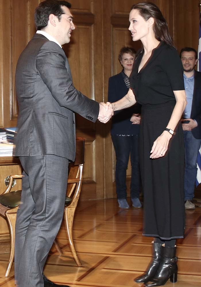 Angelina Jolie and Greek Prime Minister Alexis Tsipras shake hands