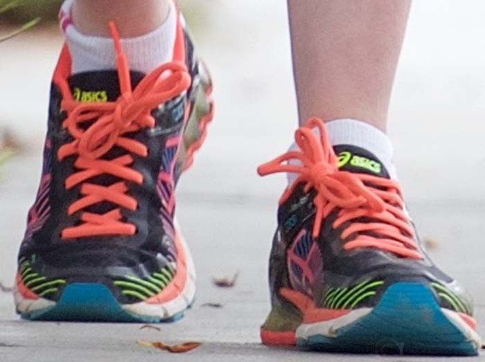 Anne Hathaway wears a colorful pair of Asics gel "Kinsei 6" running shoes