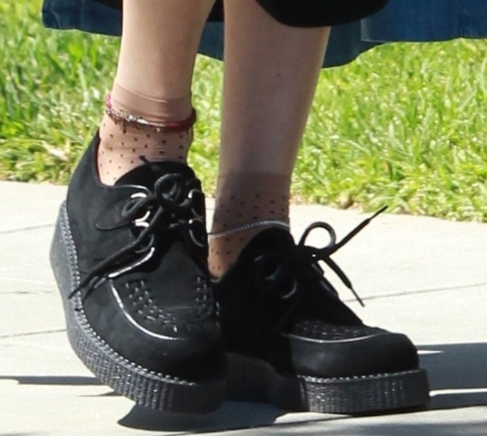Behati Prinsloo wears socks under her black T.U.K. creepers