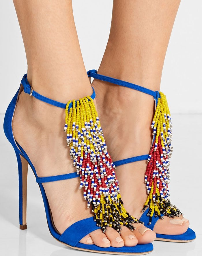 Crafted from soft suede in a vibrant shade of bright-blue, this pair is detailed with layers of beaded fringe that playfully move with every step