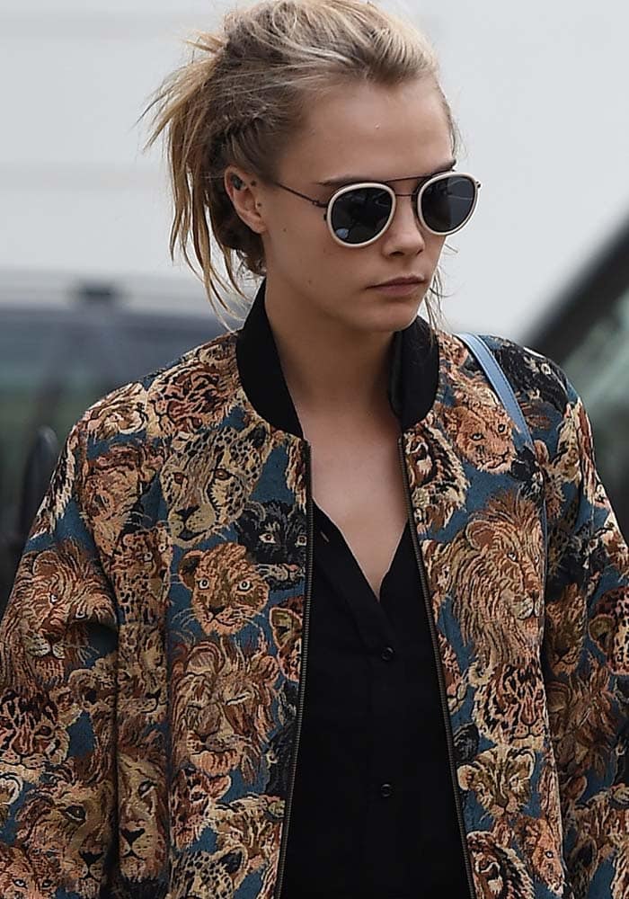 Cara Delevingne wears her hair back as she leaves her parents' house in London