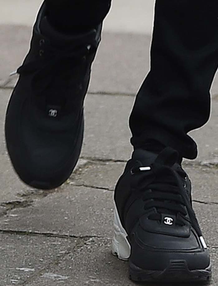 Cara Delevingne wears a pair of black-and-white Chanel sneakers