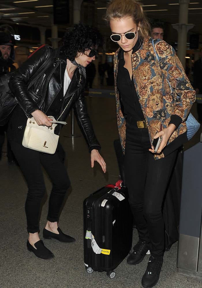 Cara Delevingne and her girlfriend Annie Clark, aka St. Vincent, leave London for Paris via Eurostar