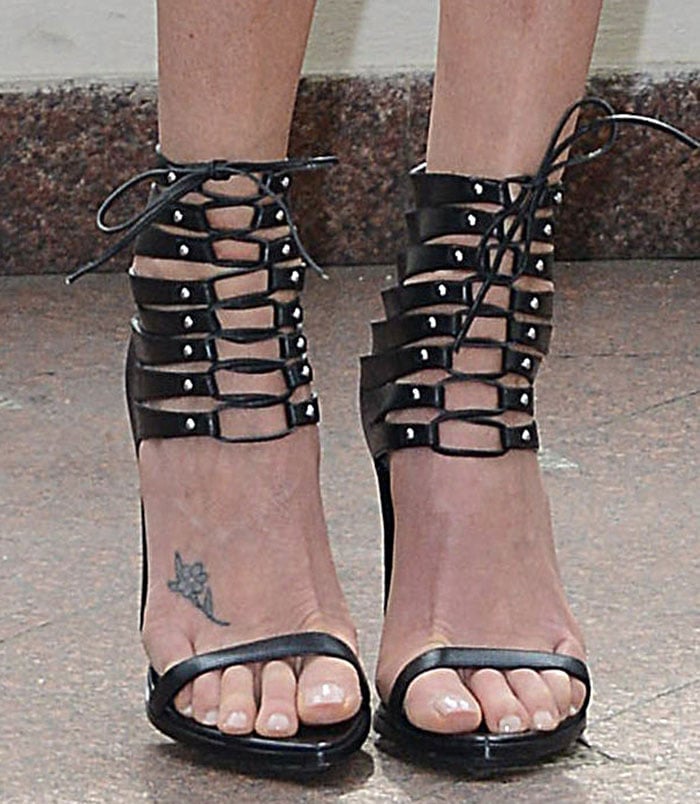 Charlize Theron's pretty toes and foot tattoo