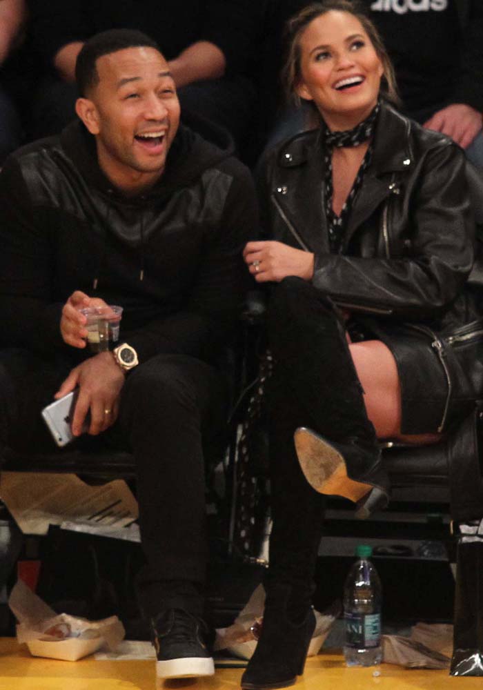 John Legend and Chrissy Teigen wear matching black outfits to a Lakers game