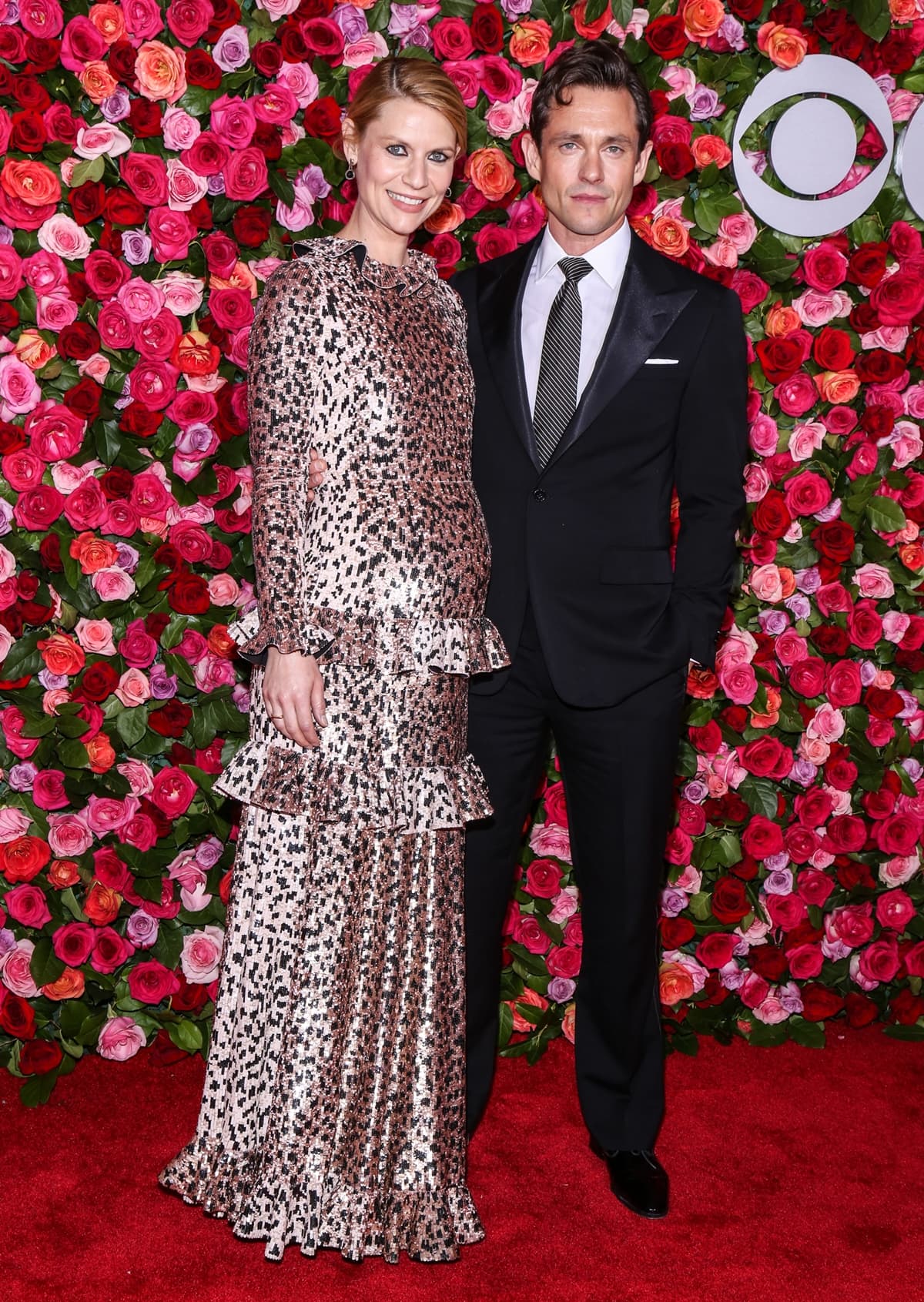 Claire Danes shows off her baby bump in a Valentino dress and Jimmy Choo shoes with her husband Hugh Dancy at the 2018 Tony Awards