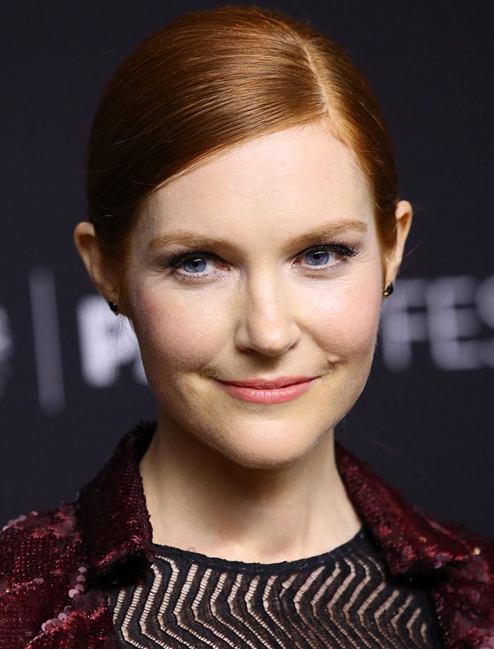 Darby Stanchfield wore her red hair in a slick side-parted ponytail