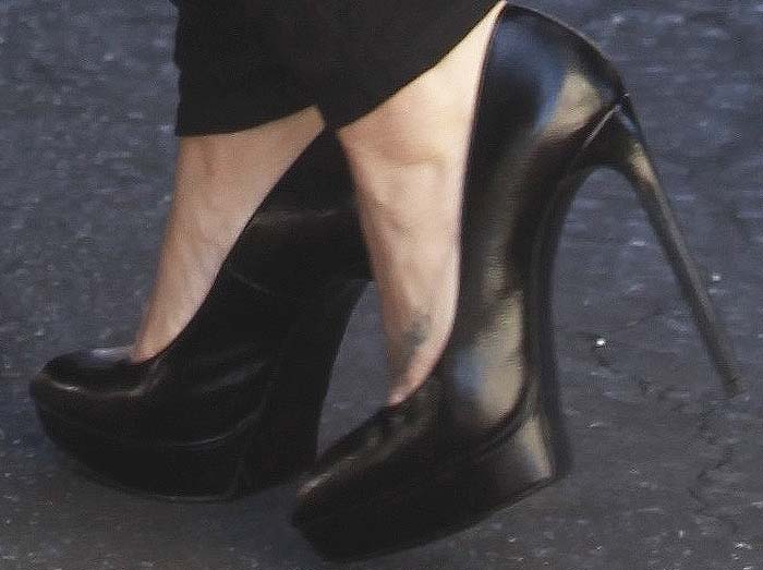 Demi Lovato's feet in black Saint Laurent platform pumps