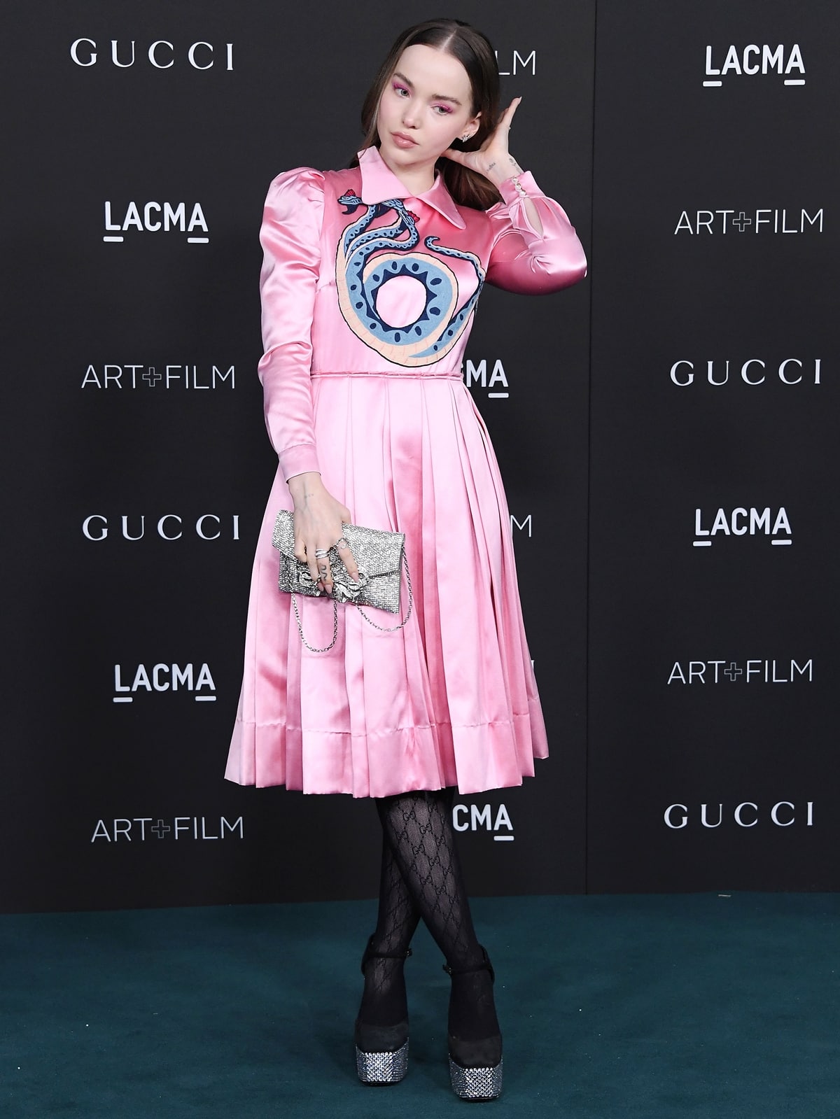 Dove Cameron paired a Gucci dress with black stockings and Giuseppe Zanotti crystal-embellished platform sandals at the 2021 LACMA Art + Film Gala